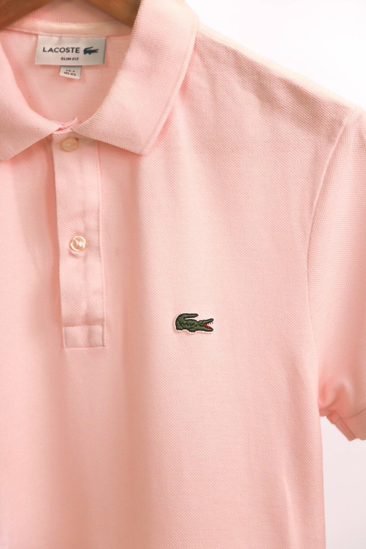 Polo rose Lacoste Taille M