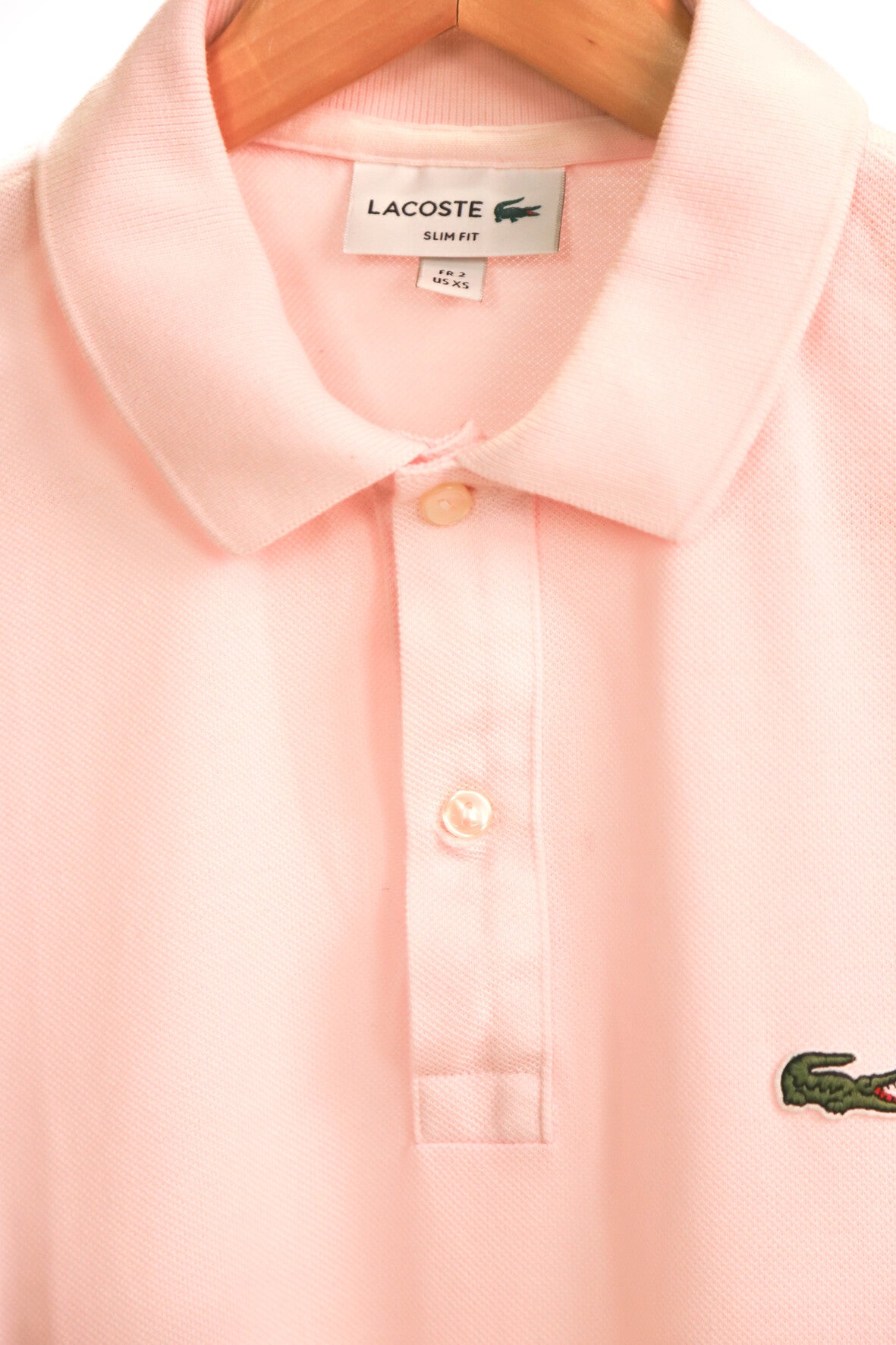 Polo rose Lacoste Taille M