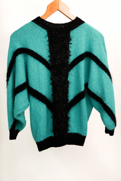 Pull vert et noir taille M