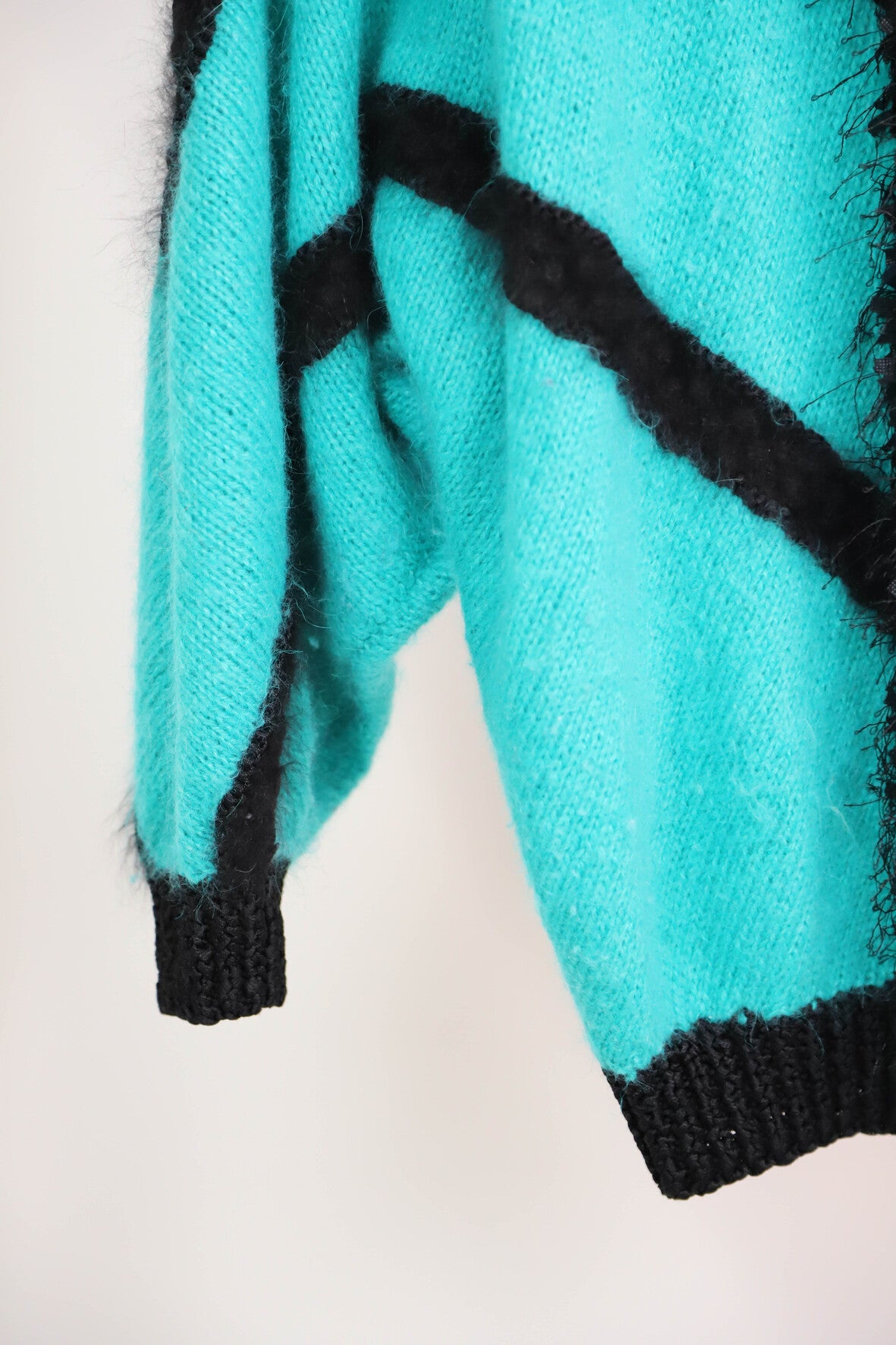 Pull vert et noir taille M