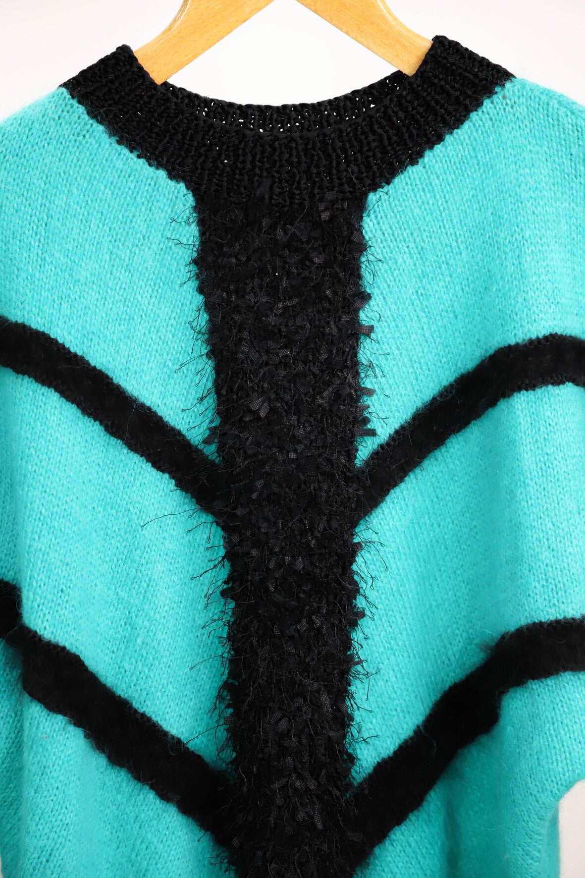 Pull vert et noir taille M
