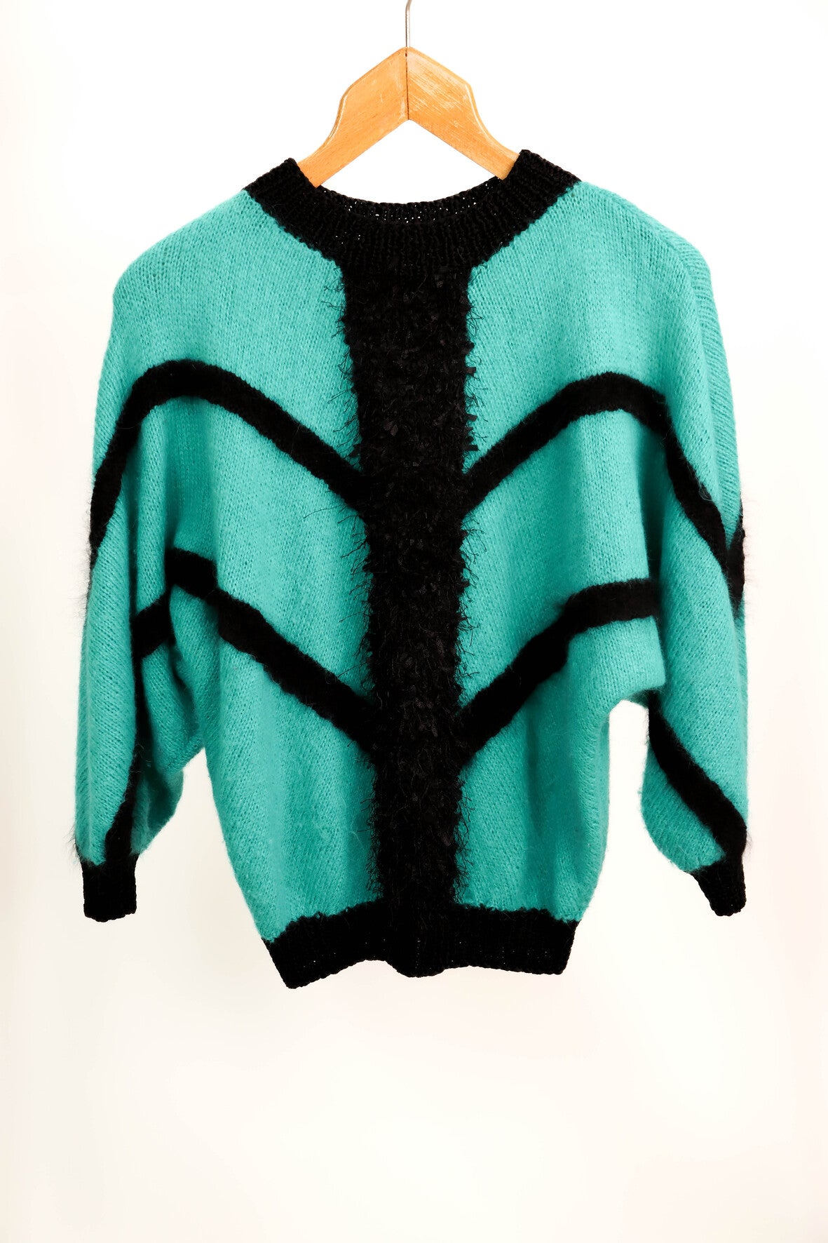 Pull vert et noir taille M