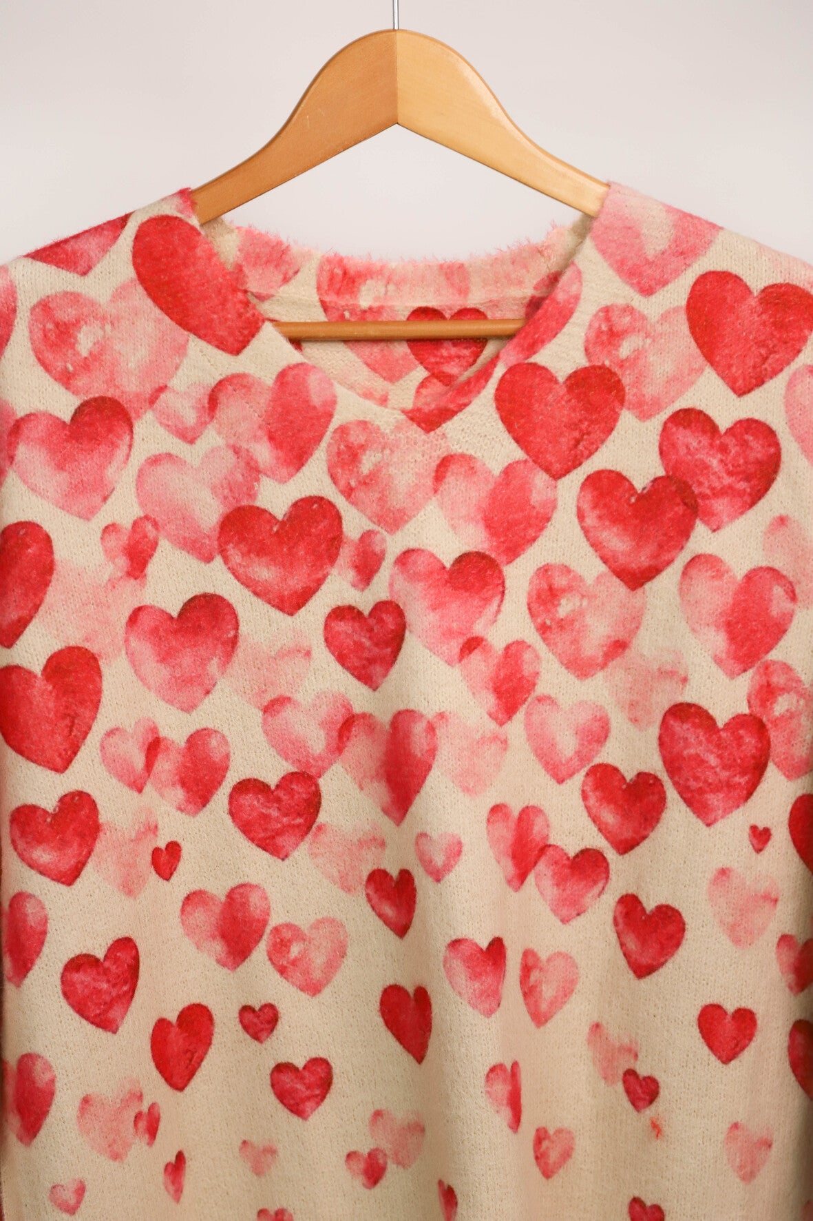 Pull beige coeurs roses Taille XL